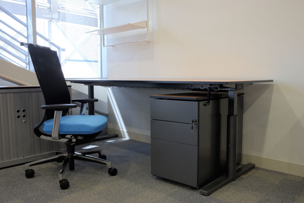 Empty desk with chair in an office